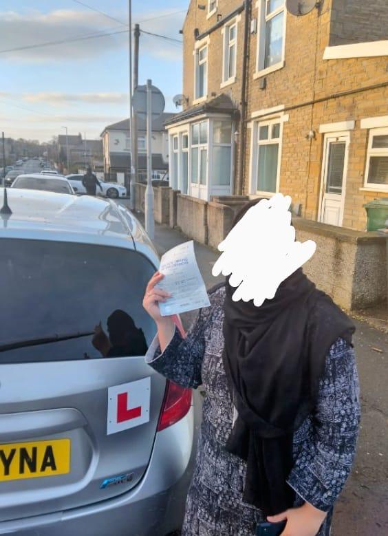 Student celebrating passing their driving test