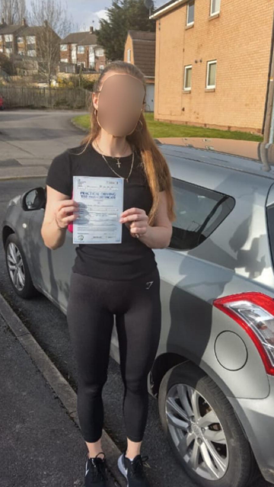 Student celebrating passing their driving test