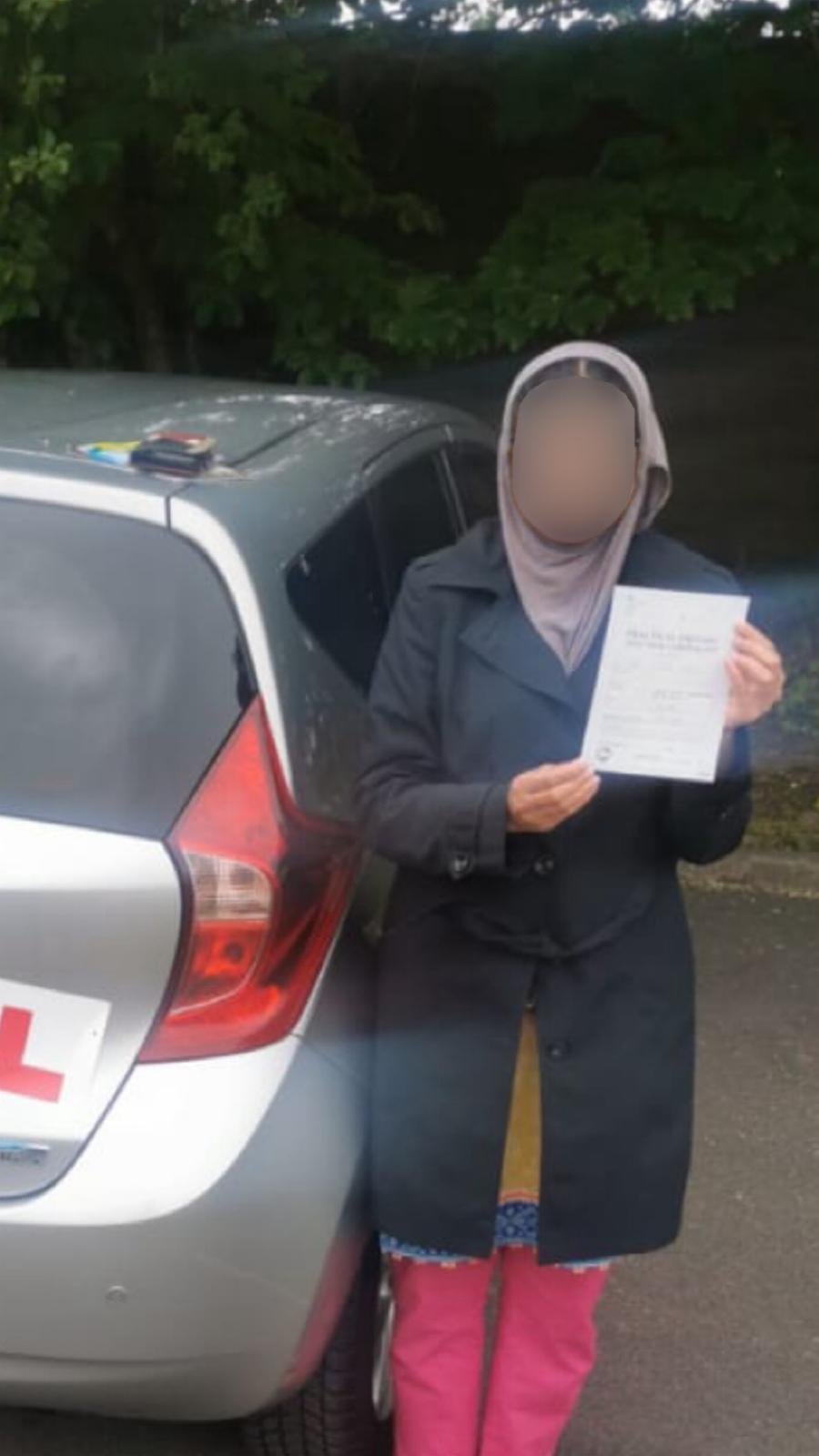 Student celebrating passing their driving test