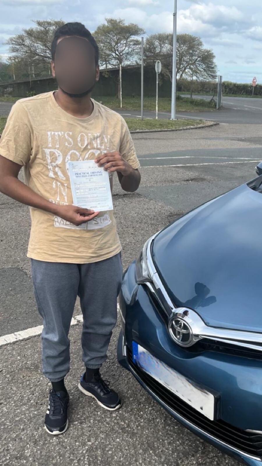 Student celebrating passing their driving test