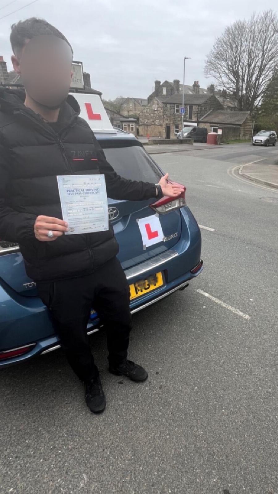 Student celebrating passing their driving test