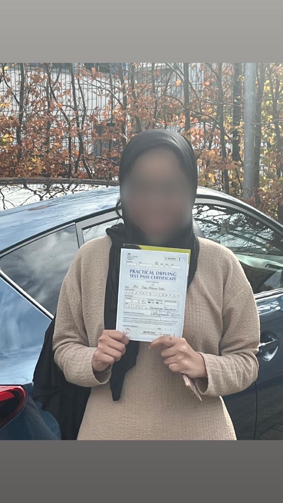 Student celebrating passing their driving test