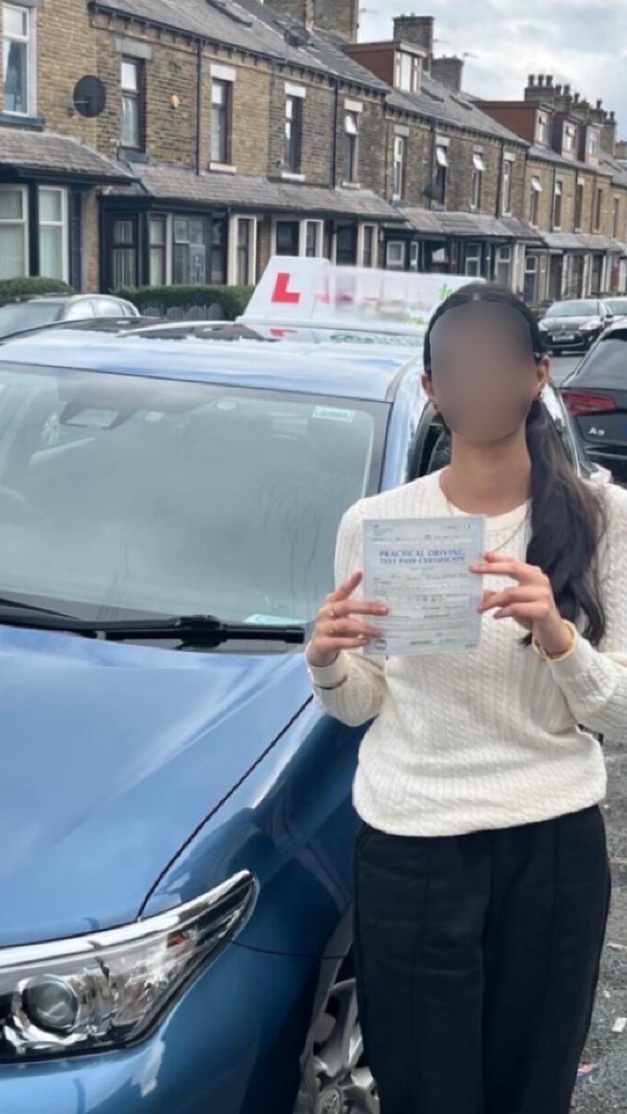 Student celebrating passing their driving test