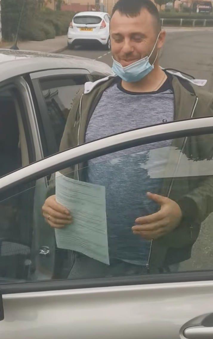 Student celebrating passing their driving test